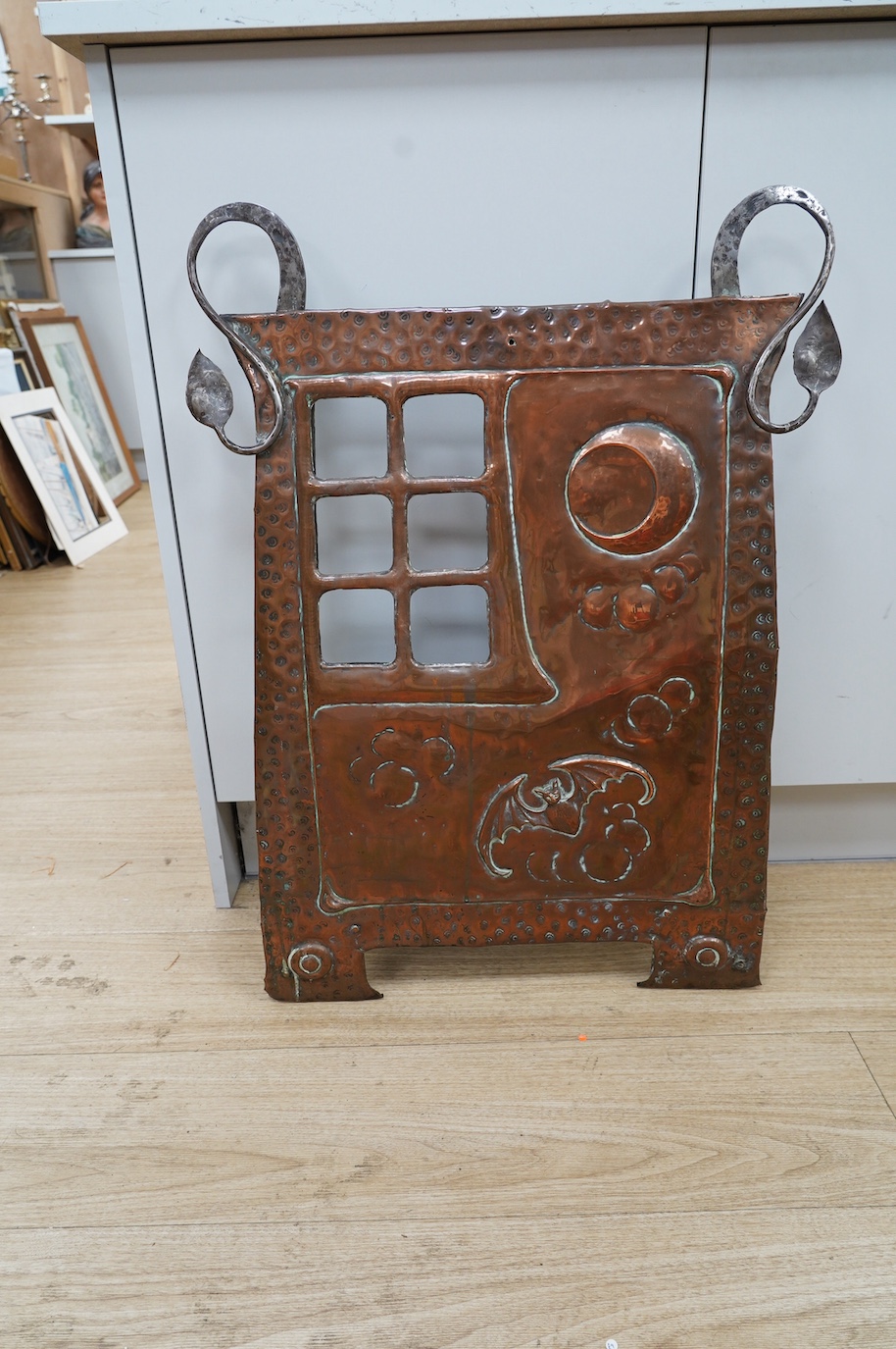 An Arts and Crafts hammered copper and wrought iron fire screen, 73cm. Condition - fair to good, lacking glass panel